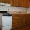 Fully equipped kitchenn with spacious oak cabinets and vent over the cook stove.